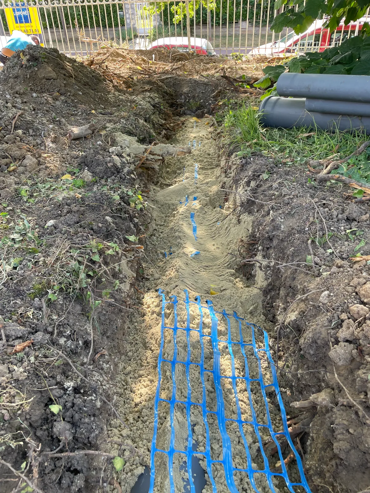 Drainage avec géotextile et réseau d'eaux pluviales sur un chantier en Essonne
